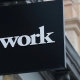WeWork Parent Weighs Slashing Its Valuation in Half